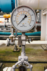 Close up shot of a pressure gauge at a jetty