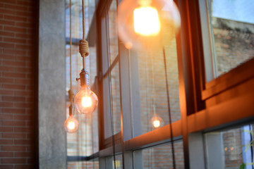 Beautiful retro style . Incandescent lamps in a modern cafe