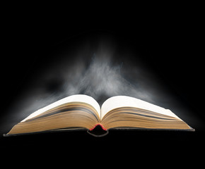 Opened book with magic light