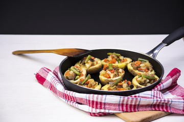 Baked potatoes stuffed with vegetables