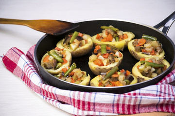 Baked potatoes stuffed with vegetables