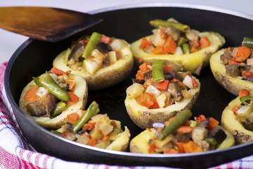 Baked potatoes stuffed with vegetables