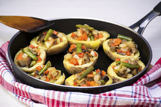 Baked potatoes stuffed with vegetables