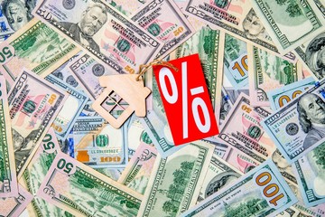 The symbol of the house lies on the background of the American currency 
