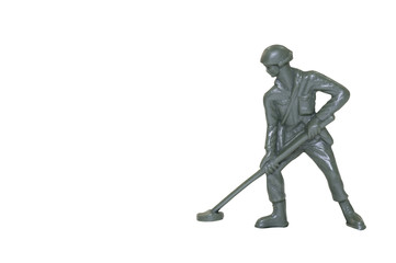 Miniature toy soldier on white background