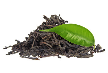 Heap of dry black tea with green tea leaf isolated on a white background