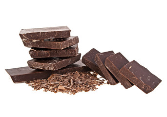 Chocolate bars and chocolate chips on a white background