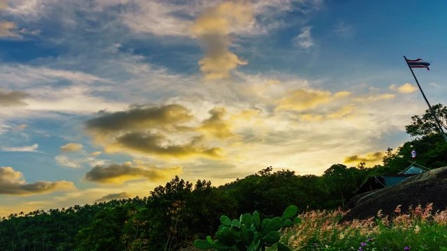 Flying clouds in the sunlight over the mountain and jungle at colourful sunset.4k time-lapse 