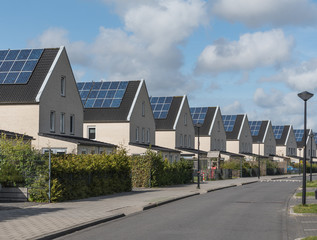 Fototapeta na wymiar Green energy, a new housing development with every house fitted with solar panels