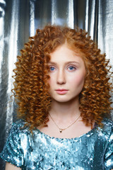 Beauty young woman with curly big and long hair. Permed . Glamour lady, Girl on grey background.