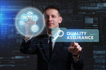 Business, Technology, Internet and network concept. Young businessman working on a virtual screen of the future and sees the inscription: Quality assurance