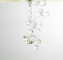 Pouring bubbles of vegetable oil