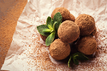 Chocolate truffle,Truffle chocolate candies with cocoa powder.Homemade fresh energy balls with chocolate.Gourmet assorted truffles made by chocolatier.Chunks of chocolate and coffee beans