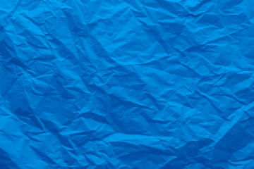 Background of a crumpled blue paper