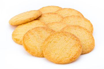 Stacked short pastry cookies isolated on white background.