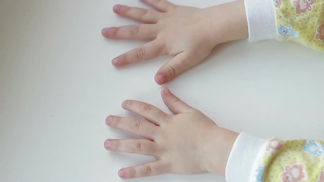 The palm of a child on a white background.