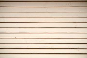 Wooden wall made of untreated, horizontal, screwed boards of spruce wood