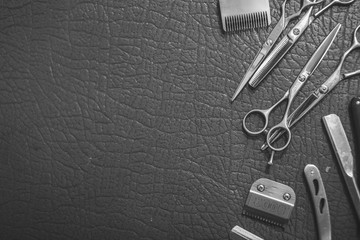 Vintage barber shop tools on skin background with place for text