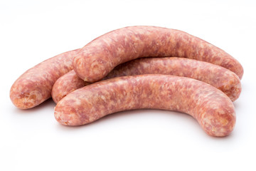 Raw sausage with parsley leaf isolated on white background.