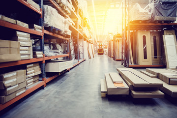 Shelf with structural materials on the shelves in the construction warehouse.