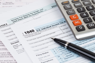 Fototapeta premium Tax form with pen and calculator