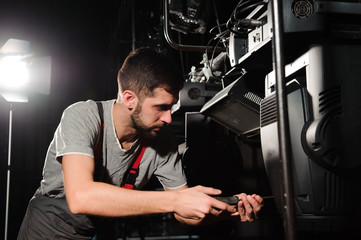 The lighting engineer adjusts the lights on the stage.