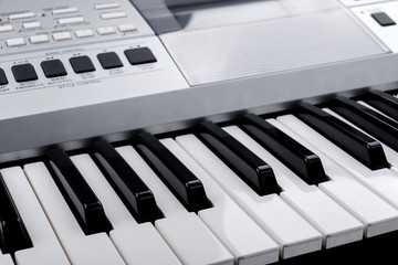 Fragment of electronic synthesizer keyboard with control buttons