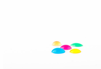 Colored drops on white background