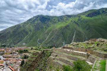 Fototapeta na wymiar Stunning aerial view to Inca ruins, town and mountains around