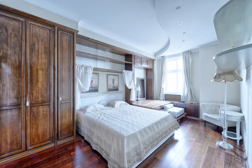 Russia, Moscow region - bedroom interior in a new luxury house.