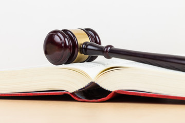 Wooden judge gavel and book