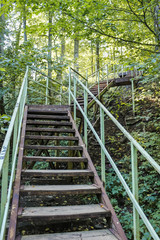 Metal staircase in the ravine. Vertically
