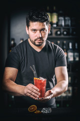 Barman is serving cocktail