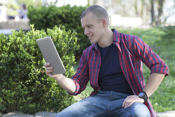 Portrait of a young man outdoors