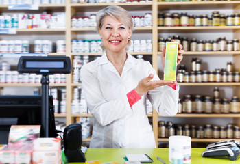 Smiling woman recommending skin care products
