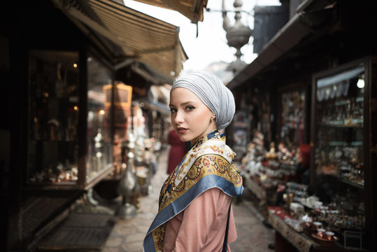 Portrait of young woman standing in market