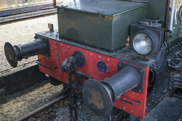 Old style hook railway coupling and buffers for linking freight train wagons with a locomotive.