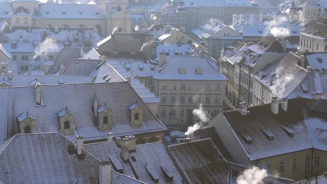 View of Prague City Rooftops, Buildings and Monuments Under the Snow in Winter