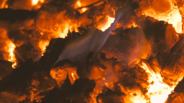 Close up of fire and flames of a bonfire burning in the night