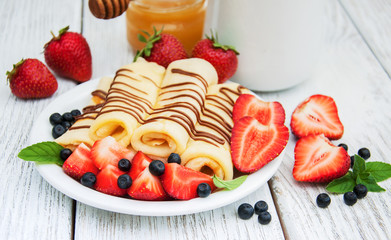 crepes with strawberries and chocolate sauce