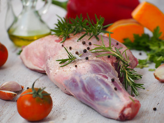 Fresh and raw meat. Leg of lamb on wood background