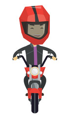 Young man riding motorcycle at night.