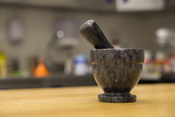 Marble mortar and pestle on kitchen table