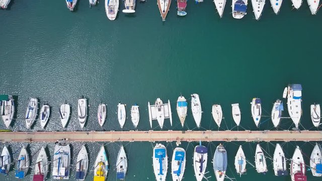 Large marina with various Yachts and boats - Aerial footage