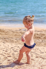 Little baby girl on beach