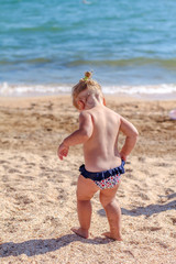 Little baby girl on beach