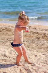 Little baby girl on beach