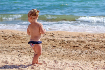 Little baby girl on beach