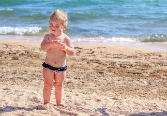 Little baby girl on beach