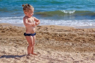 Little baby girl on beach